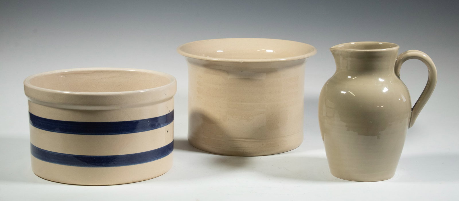GLAZED POTTERY VESSELS - TIFFANY & CO., BERNARD PICHON: (3) Piece Lot, incl: Large cachepot, cylindrical shape with flared rim, marked JMY and Tiffany & Co. on base, 7" high, 10" diam., rim flake; French pitcher, by Uzes - Bernard Pichon Fait Main, 8 1/2" 