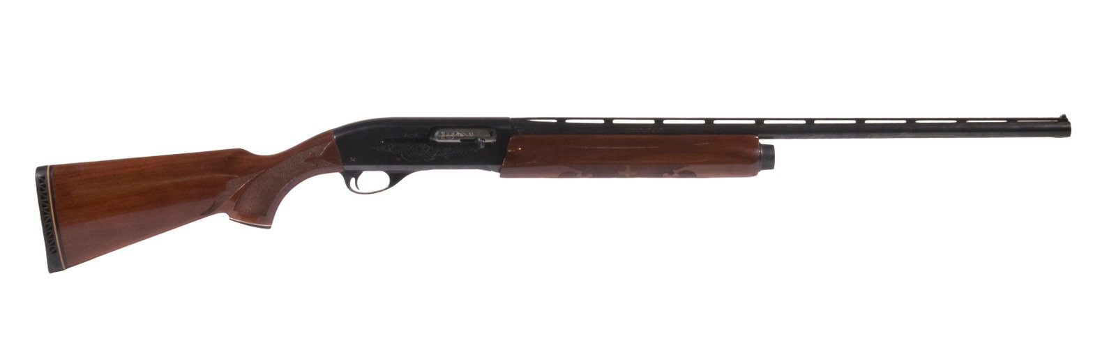REMINGTON MDL. 1100 SHOTGUN, 20 GA: A skeet-grade Model 1100 semi-automatic shotgun made by the Remington Arms Company. The shotgun features a vent-rib barrel with fixed choke fixed to an engraved receiver both with deep blue finish mou