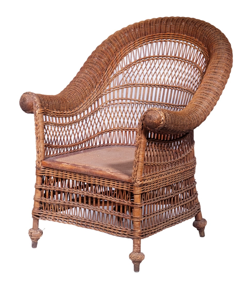VICTORIAN WICKER ARMCHAIR: Natural Woven Rattan Chair, with arched and rolled back, spindle lattice back and apron, 34" high, 26" x 22", 14" high seat.