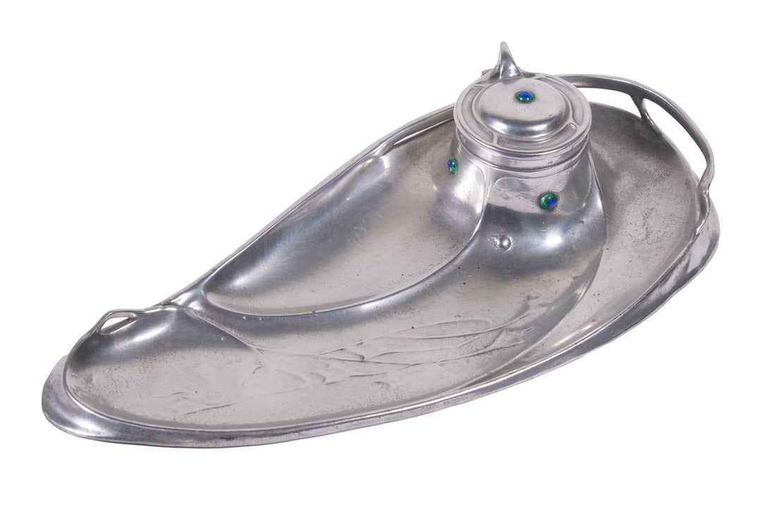 OSIRIS JUGENDSTIL JEWELED PEWTER INKSTAND: Ca. 1900 German (Walter Scherf & Co., Nuremburg) Art Nouveau Pewter Inkstand, #682, flowing design with pierced galleried right edge and embossed floral decoration, hinged inkwell lid with inset jewel