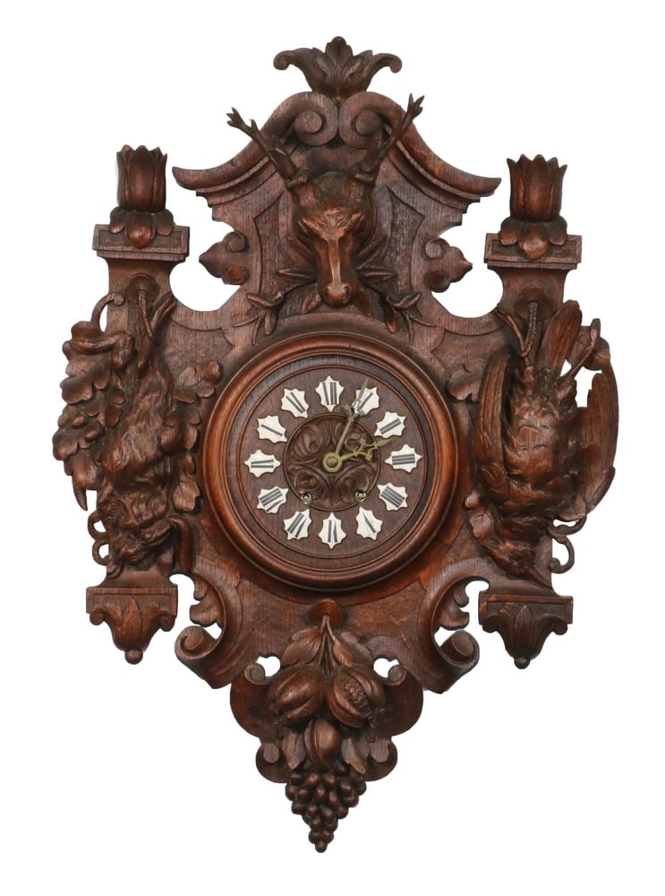 CARVED BLACK FOREST WALL CLOCK: Late 19th c. Black Forest Figural Wall Clock, in carved oak decorated with carved game and fruits, with black Roman numerals on white enameled plaques, time and strike brass movement (pendulum, but no