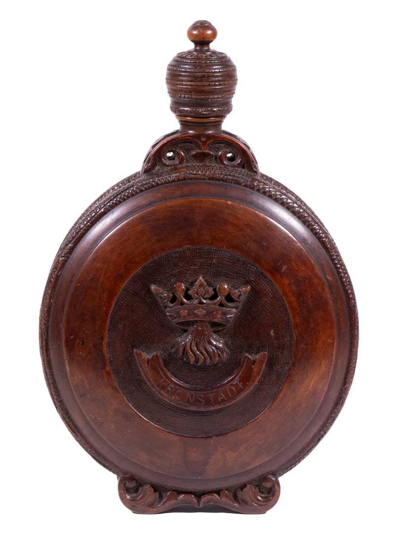CARVED WINE FLASK: Late 19th c., Upright black forest carved wine flask. Wax lined. Crest on one side with the name "KRONSTATD". Romanian, black walnut, with carved blossom medallions on both sides, roped edge, leaf scr