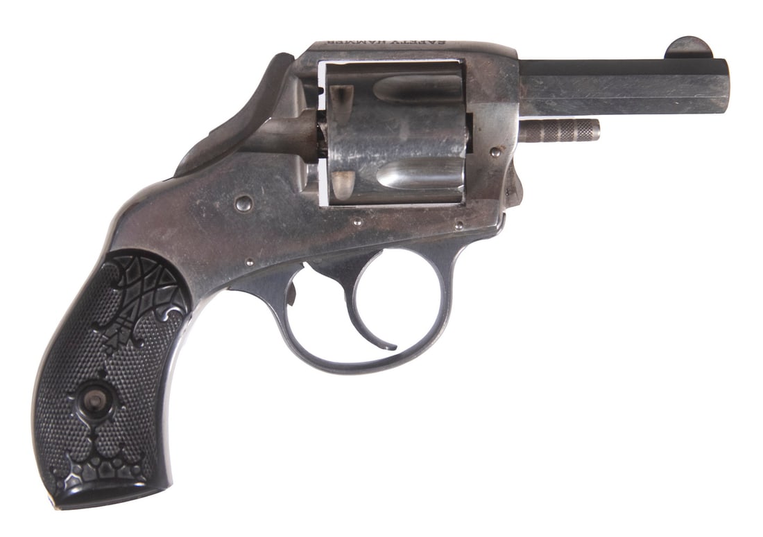 H&R SAFETY HAMMER DOUBLE ACTION, .38 S&W: A DA/SA revolver made by the H&R company. The gun features an octagonal barrel, bobbed hammer, checkered black plastic grip panels and a nickel-plated finish throughout. The piece is in overall fine c