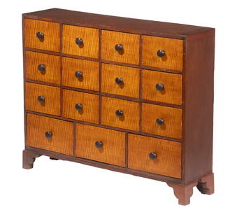 15-DRAWER APOTHECARY CABINET: Country Cherry Apothecary Chest, having fifteen dovetailed drawers with tiger maple fronts and wooden pulls, set on bracket feet, 28 1/2" high, 34 1/2" x 9 1/2".