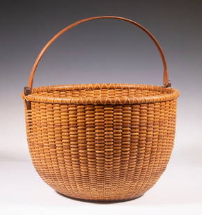 NANTUCKET BASKET, ATTRIB. TO WILLIAM SEVRENS (1916-2001): Vintage Handcrafted Swing Handle Lightship Basket, unsigned but in the style of master weaver Bill Sevrens, having a rosewood base with interior incised concentric circles and 1977 penny glued to cent