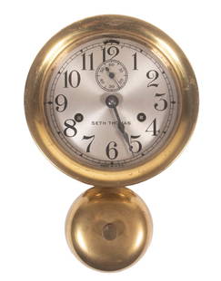 SETH THOMAS SHIPS BELL CLOCK: Brass Cased Wall Clock, silvered dial, hinged bezel, time and strike movement with key, 10" high, 7" wide.