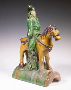 CHINESE FIGURAL ROOF TILE: 18th - 19th c. Sancai Glazed Pottery Tile, in the form of a government official on horseback, on a curved base, 16 1/2" high, 12" x 5 1/2".