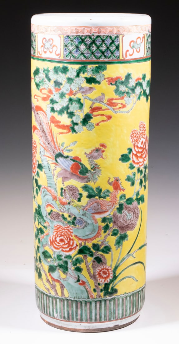 CHINESE QING PORCELAIN UMBRELLA STAND: Famille Rose on Imperial yellow ground, decorated with pairs of exotic birds on flowering branch (kache-e), with a band of symbols of fortune at top, geometric band at bottom, 23 1/2" x 9" diam.