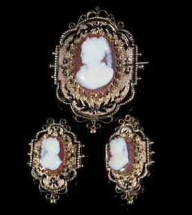 VICTORIAN CAMEO BROOCHES: (3) Ca. 1880 14K Yellow Gold Mounted carved shell cameo pins depicting female bust profiles, with black enamel highlights, 1 1/8" x 3/4" to 1 3/4" x 1 1/4", 9.3 dwt. One with old back repair.