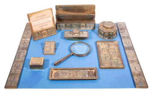 (10 PC) TIFFANY BRONZE DESK SET "BOOKMARK" PATTERN: All pieces marked "Tiffany & Co. New York" bronze with enamel, engraved with date of "June 29, 1918" (except blotter ends, letter stand and magnifying glass), several pieces having monogram "K-O".