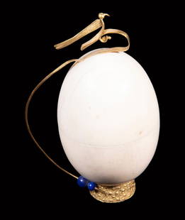 HENRY SHAWAH (1920-2009) GOLD MOUNTED SCULPTURE: Bird and Egg, 18K yellow gold & ivory sculpture, signed "Shawah" on base and marked "18K", depicting a small bird perched atop an ivory egg, with two lapis beads at the base, inside the egg is a