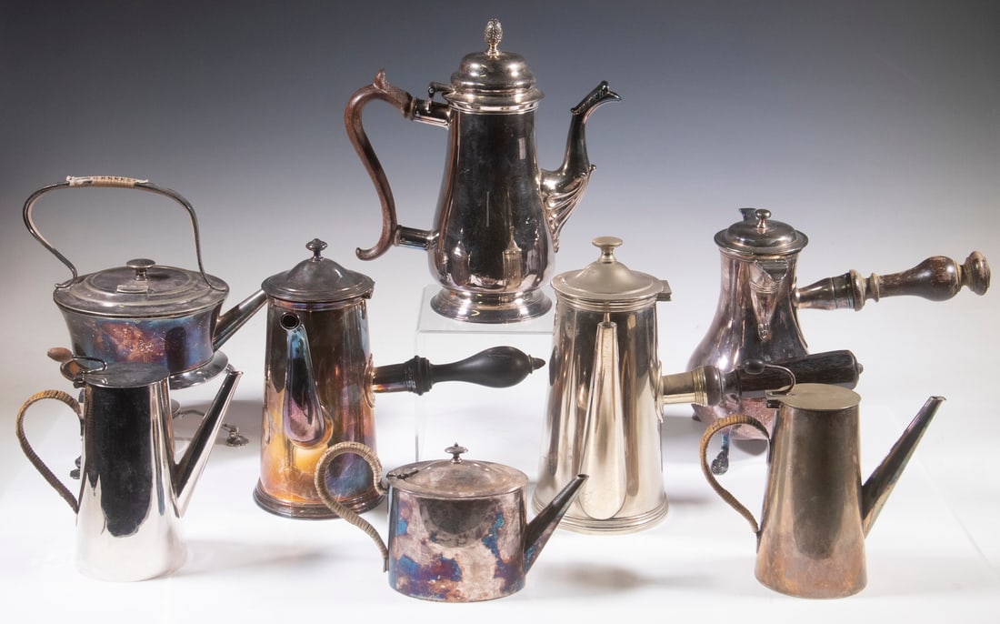 ENGLISH & FRENCH SILVER-PLATE BEVERAGE POTS: (8) Piece Collection, incl: (2) Art Deco Asprey & Co, London coffee pots, with cane wrapped handles, 6 1/2" high; Christofle French chocolate pot, #275019, with curved spout and side mounted turned wo