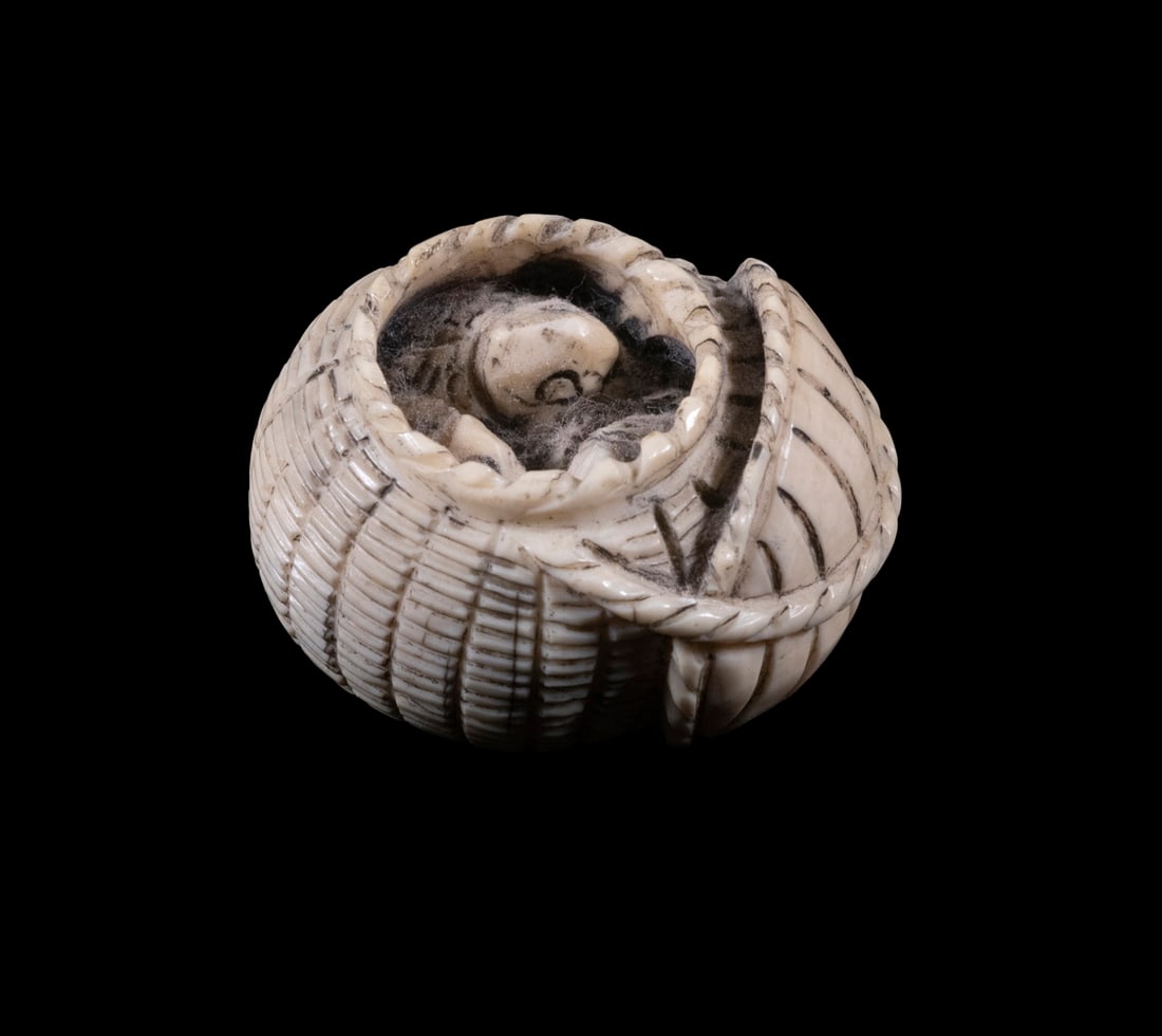 JAPANESE IVORY NETSUKE: Open Basket of Fish, signed on bottom edge of flipped back lid, 1" tall.