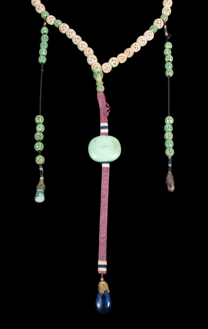 CHINESE CARVED BONE COURT NECKLACE: Early Necklace, with (91) carved openwork bone beads, turquoise pendant, and blue teardrop pendant, and two tassels with stone teardrop pendants, main necklace: 40" long, plus 11 1/2" central drop wit
