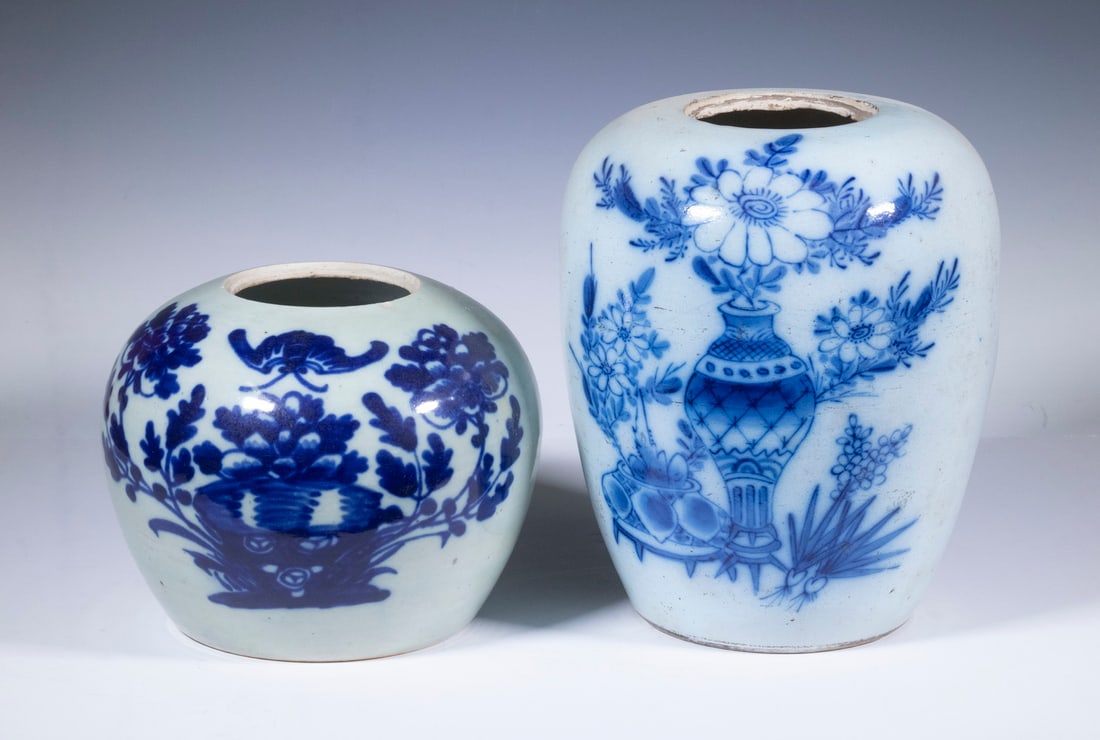 (2) CHINESE JARS: Glazed Porcelain Jars, both unmarked and missing lids, incl: Tall jar with blue painted floral decoration, 10 1/2" high; and Celadon low jar with floral and bat decoration, 7 1/4" high, rim chip.