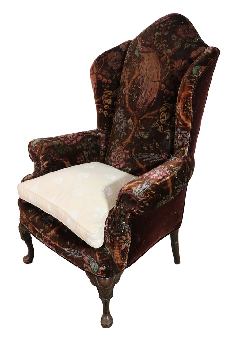 UPHOLSTERED ARMCHAIR: 20th c. High-back Armchair with shallow wings set on carved Queen Anne legs; comes with slip cover. 51" high, 35" x 28". Condition as found.