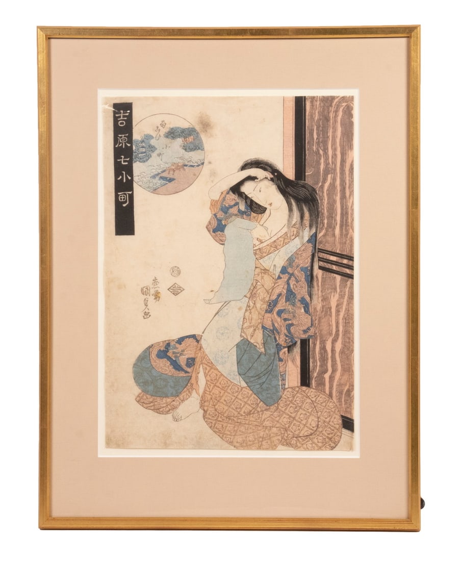 KESAI EISEN (JAPAN, 1790-1848): Portrait of a Geisha from "Yoshiwara Beauties", depicting a woman in a rabbit decorated robe, reading a scroll while combing her hair, in gilt stick frame, floated within mat under glass, OS: 19 1/4" 