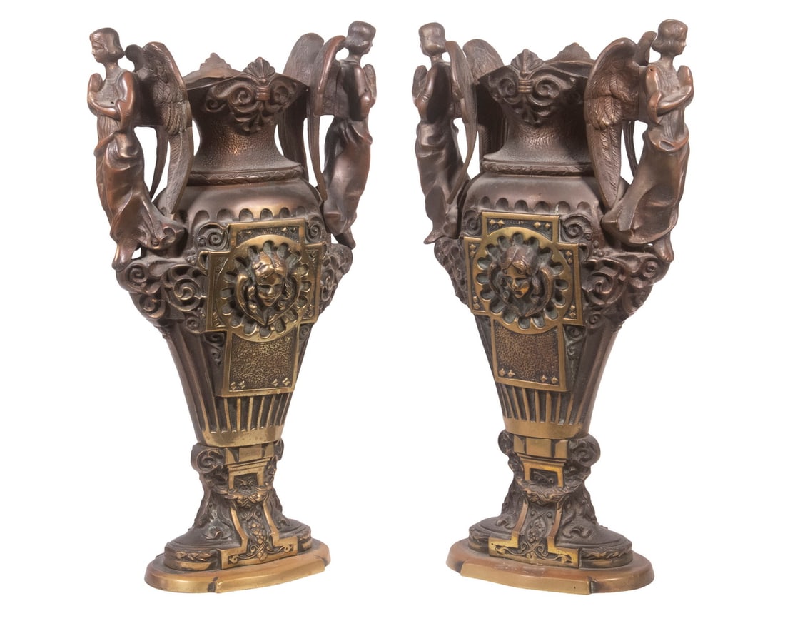 PR BRONZE FIGURAL URNS: Pair of Heavy Cast Bronze Vessels, with angel form side handles, ribbed and scrolled surface, 19" high, 10" x 5 1/2".From the Dan Fogelberg Estate, Deer Isle, Maine