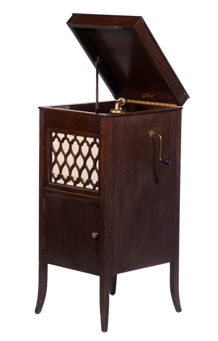 EDISON FLOOR MODEL 10" DISC PHONOGRAPH MODEL H 19 IN CHERRY HEPPLEWHITE CASE: With gilt fixtures, horizontal gilt & (2) vertical nickel-plated transducers, internal horn, decal, plate giving s/n SM-64672. Fleur-de-Lis grille, storage cabinet at bottom. 42" x 18" x 21", very cle