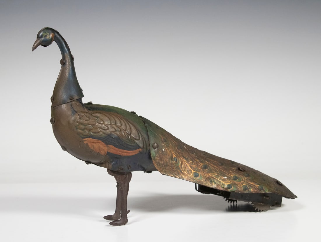 HANS EBERL TIN CLOCKWORK TOY PEACOCK: Circa 1915 German Tin Lithographed Wind-Up Pao-Pao Toy Peacock, with walking mechanism, original surface, 6 1/2" high, 9" x 4 1/2".