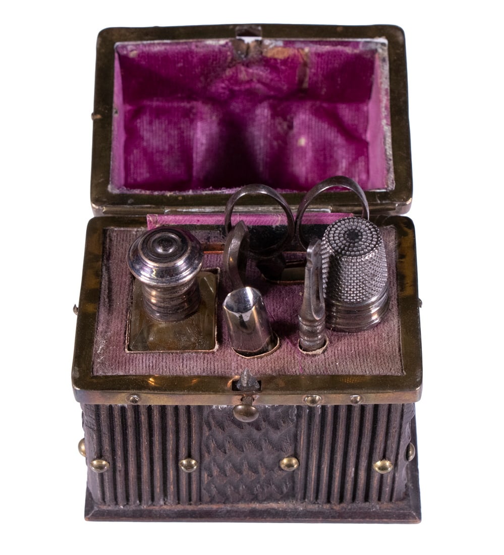 BLACK FOREST WOOD CASED NECESSAIRE: 19th c. Ladies Etui, with brass mounted carved wooden case with hinged lid, likely a Grand Tour souvenir, the fitted velvet-lined interior includes a cut crystal perfume bottle with silver on copper l