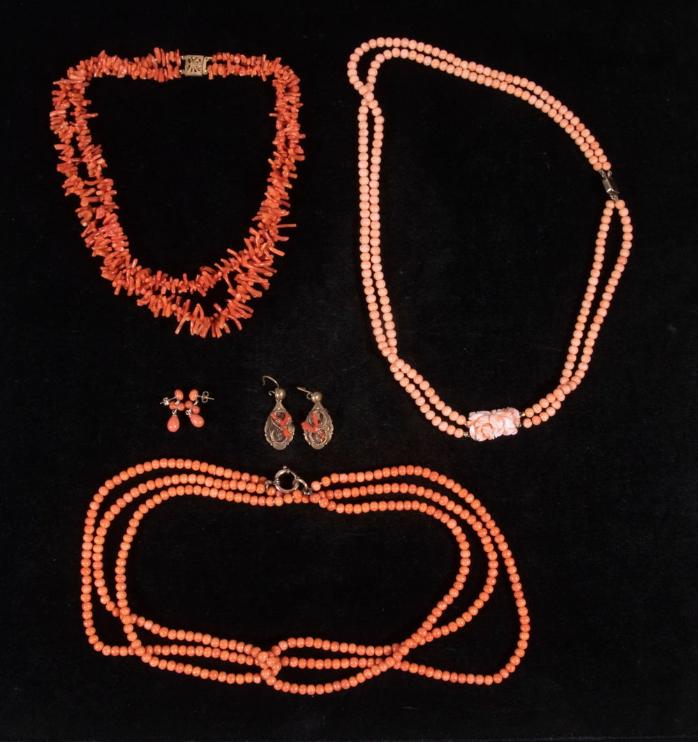CORAL BEAD JEWELRY: (5) Piece Lot, incl: Double strand necklace of pink coral beads, with carved floral form pendant, with gold filled clasp, 22" long; Double strand graduated red coral branch bead necklace, 16 1/2" long