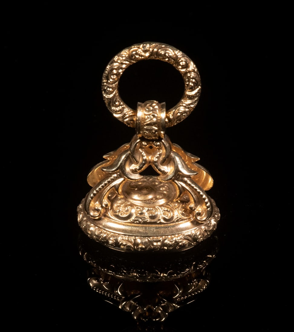 GOLD FOB SEAL: Fancy 14K Yellow Gold Fob, with top loop, a matching pair of birds of paradise below suspending an oval base with engraved RG monogram seal, 1 1/2" high (loop up), 1" x 3/4", 7.0 dwt.