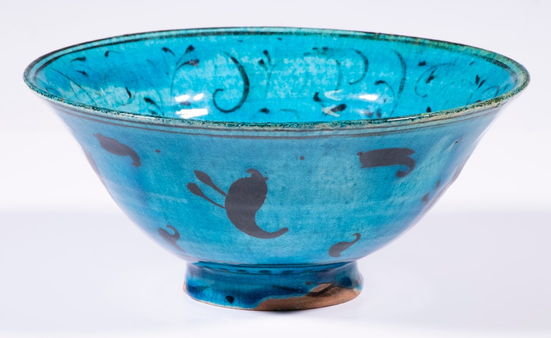 SIGNED 1924 PERSIAN STYLE POTTERY BOWL: 20th c. copy of a Seljuk turquoise bowl with Western Iranian willow tendril and antelope decoration, the outside covered in birds and fish forms, signed inside the small recessed foot "Wlaters, 1924",