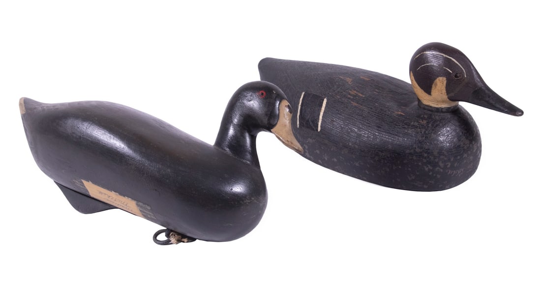 DUCK DECOYS, ONE BY R. MADISON MITCHELL (MD, 1901-1993): Lot of (2) Carved and Painted Decoys, incl: Black duck, with painted eyes, attached base weight, affixed label marked "Madison Mitchell", 11 1/2" long; and Black duck with head and wing stripes, tack 
