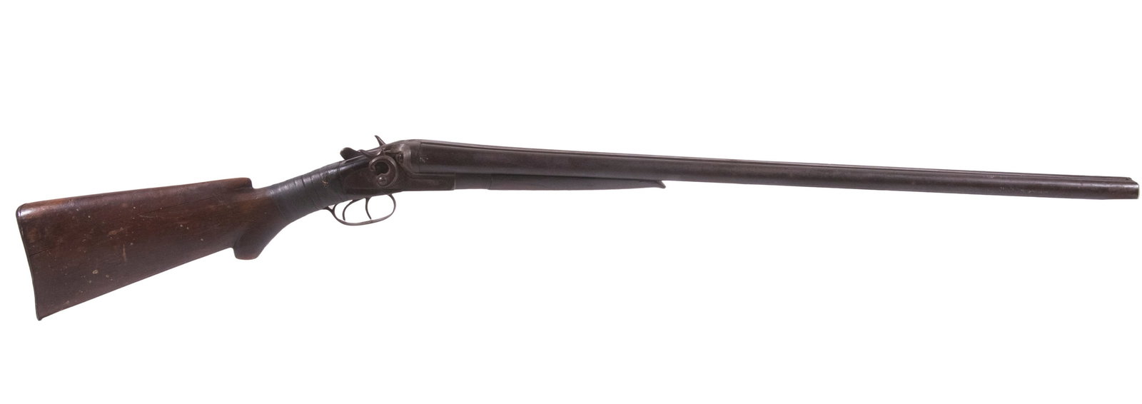 ECLIPSE COMPANY SIDE BY SIDE SHOTGUN, 12 GA: A double-barrel, exposed-hammer shotgun manufactured by the Eclipse Company and in poor condition. The firearm has numerous dings and scratches throughout with several long cracks and heavy dings in t