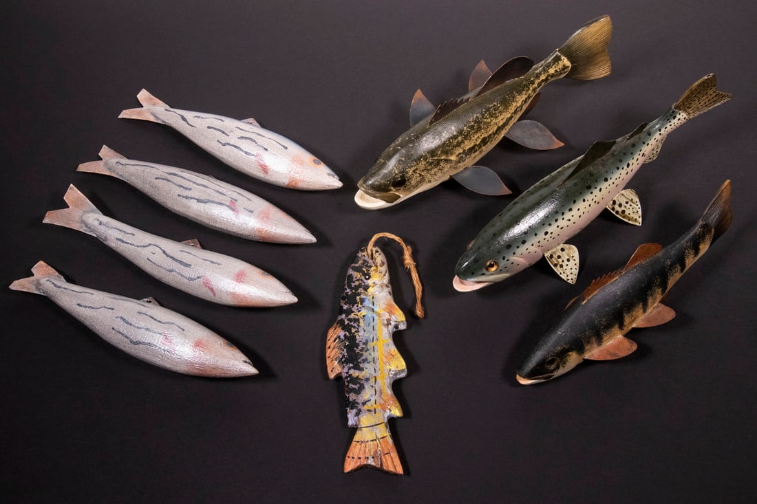 CARVED FISH DECOYS: (8) Piece Lot, incl: (3) Finely carved and painted decoys, all signed LA, probably by Virginia carver Larry Ackerman, with glass eyes and copper fins, 7" to 9" wide; (4) Blue, silver and pink painted 