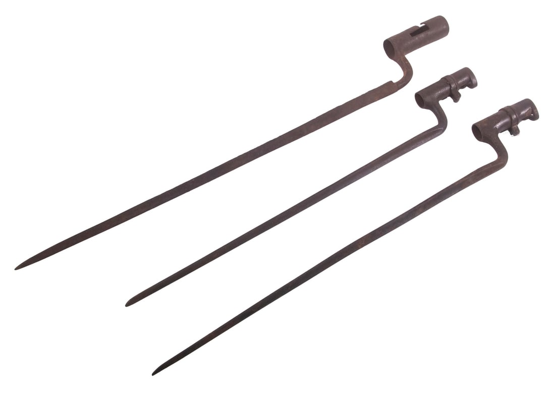 (3) SOCKET BAYONETS: A lot of three socket-style bayonets, two being Civil-War era Springfield bayonets, and the other a Colonial era bayonet. The Springfield bayonets are in fine condition with some areas of surface rust