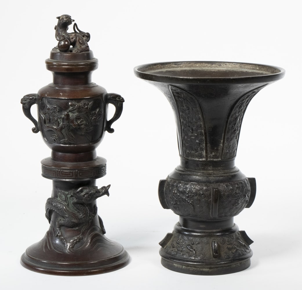 (2) JAPANESE BRONZE VESSELS: Including: Meiji Period vase with flared rim, 7" high; and Lidded urn with foo dog lid finial, dragon side handles and relief molded dragon surrounding base, 9" high. Good condition.