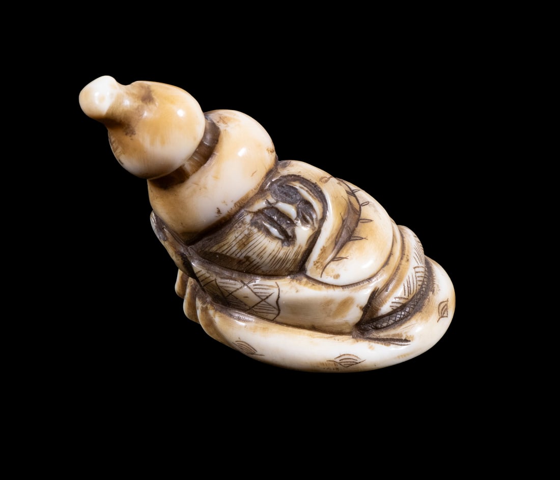 19TH C. JAPANESE IVORY NETSUKE: Figure of a squatting happy Brewer Monk offering a double gourd of beer, signed, 2" tall.