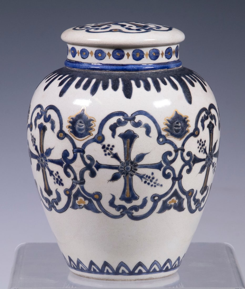 JAPANESE SATSUMA PORCELAIN JAR: Lidded Ginger Jar or Tea Canister, with raised blue and gilt decoration, blue painted Satsuma and Japanese character marks on base, 5 1/2" high, 4" diam. Good condition.