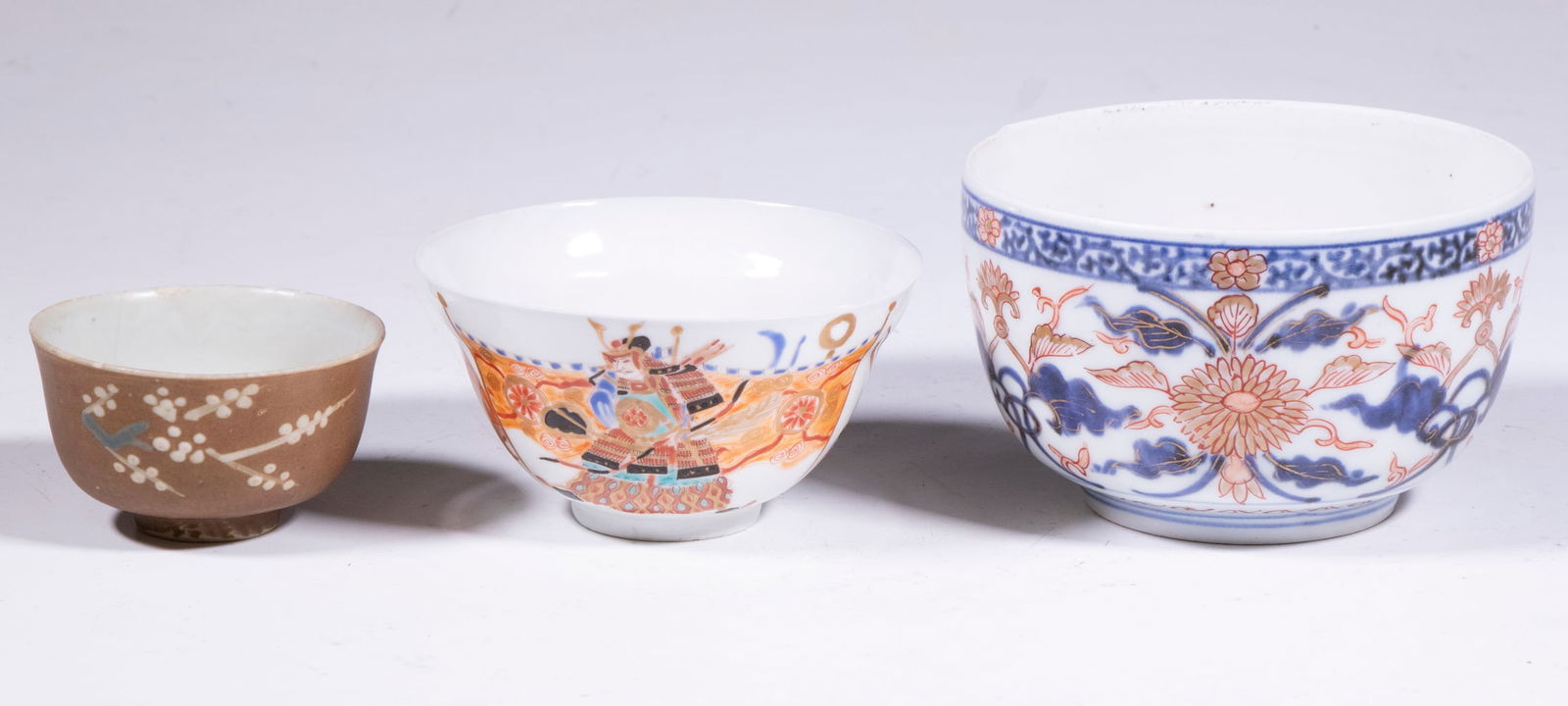 JAPANESE PORCELAIN DISHES: Group of (3) Cups & Bowl, incl: Hand painted eggshell porcelain cup, decorated with warrior images, 2" high, 3 3/4" diam.; Small tea cup with matte brown glaze and raised white and green floral decora