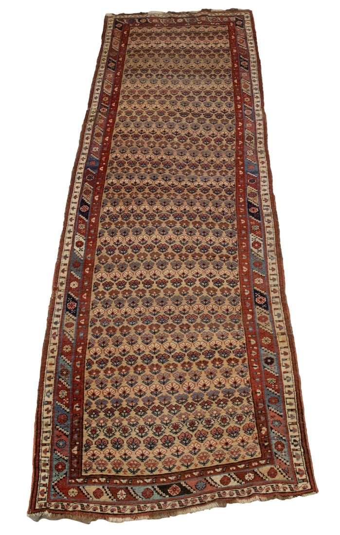 KAZAK RUNNER (3'2"X10'4"): Southwest Caucasus. Has staggered rows of flowering plants in combinations of tan & ivory, sky & midnight blue, and rust red. In the background is a gold field with a rust rosette on the border. Good 