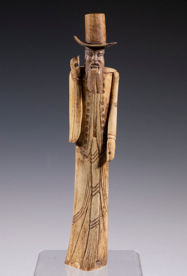 KOREAN CARVED BONE FIGURE: Standing Figure of a Korean Priest in Traditional Hanbok Dress, circa 1930's, in the original cardboard box. 11 1/2" tall.