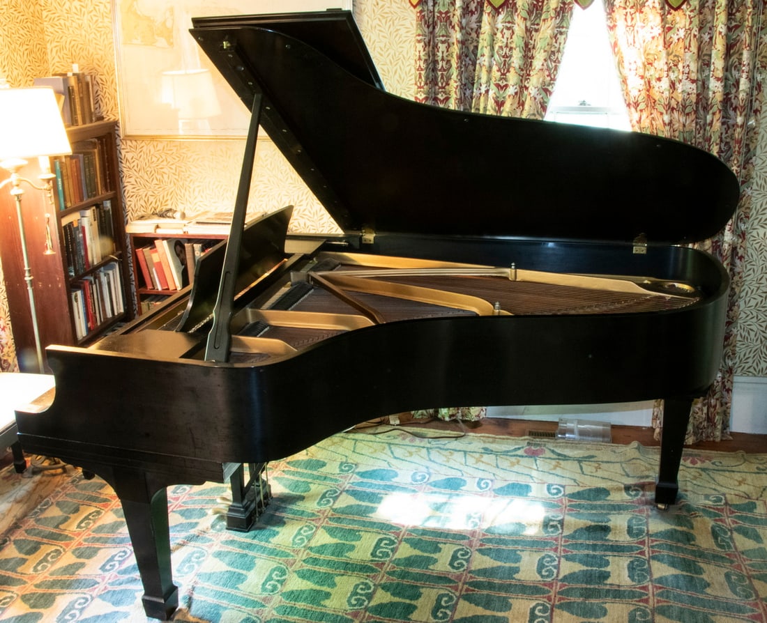 STEINWAY MODEL B GRAND PIANO WITH BENCH: Classic Grand Piano by Steinway & Sons, with ebony finish surface, sn 418963, year of manufacture: 1971, 6' 11" long, 58" wide, fine condition, one minor chip; with matching bench. This item is sold o