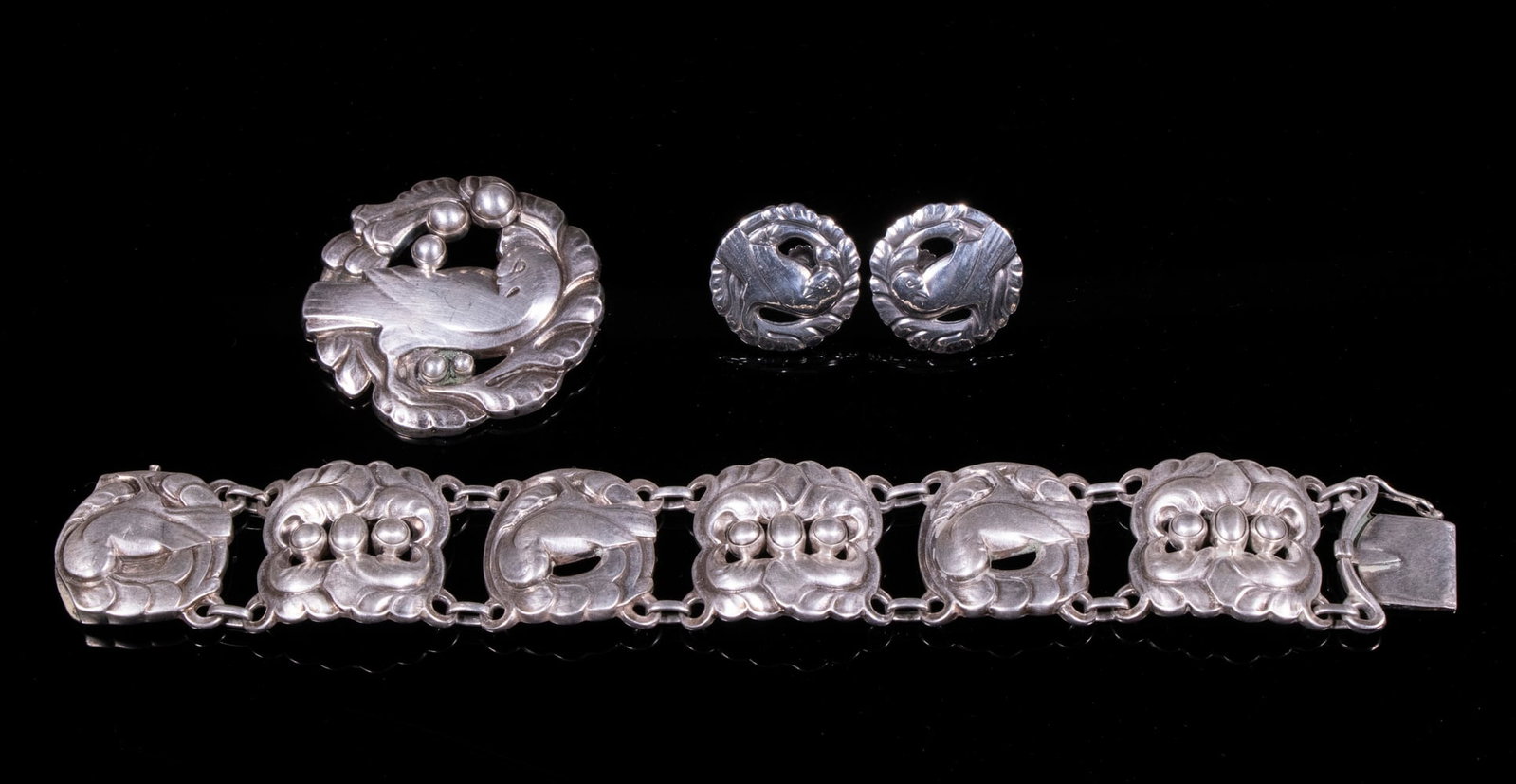 GEORG JENSEN STERLING "DOVE" JEWELRY SUITE: (3) Pieces of Danish Sterling Silver Jewelry designed by Kristian Moehl-Hansen, mid-20th c., including: Bracelet, # 32, with six square links, 7 1/4" long; Brooch, #123, 1 7/8" diam.; and Pair of scre