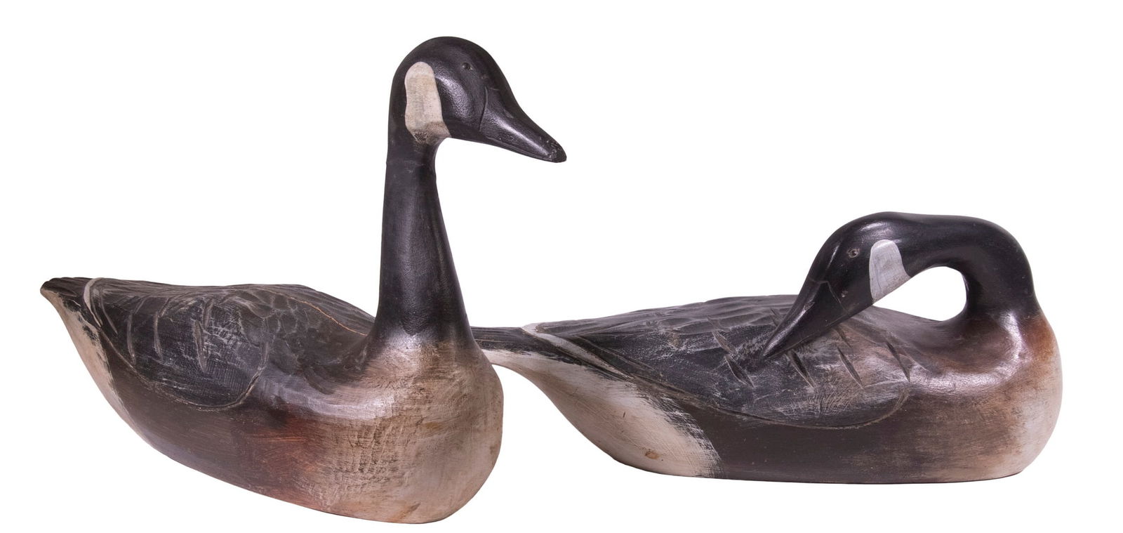HANK HENRY WALKER (MA, 1919-1995) CANADA GOOSE DECOYS: Group of (2) Carved and Painted Decoys, one preening and one upright, with tack eyes, both signed on base plaques, 15 1/2" high, 23" long and 9 1/2" high, 21" long. Back shrinkage crack on upright goo