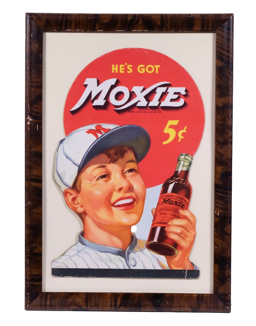 MOXIE DIECUT BASEBALL BOY AD, CA 1930, FRAMED: Countertop Ad of Little League player, easel-back display depicting him holding a red label bottle up with a big smile on his face, having the caption "He's got Moxie. 5c". In faux burl walnut frame, 