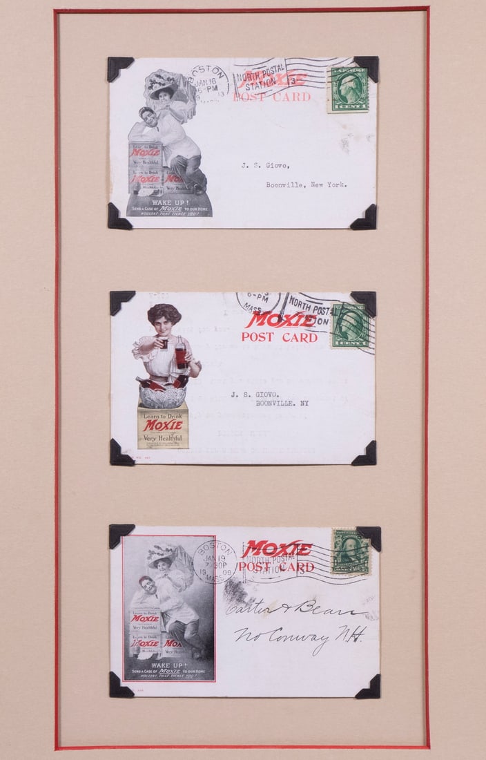 (3) MOXIE MAID POSTCARDS IN ONE FRAME: Mailed from Boston, 1909, all having printed cachets of beautiful woman hawking Moxie, two are similar humorous scenes with couples, one (in color) has a woman with bottles in a cut glass bowl of ice,
