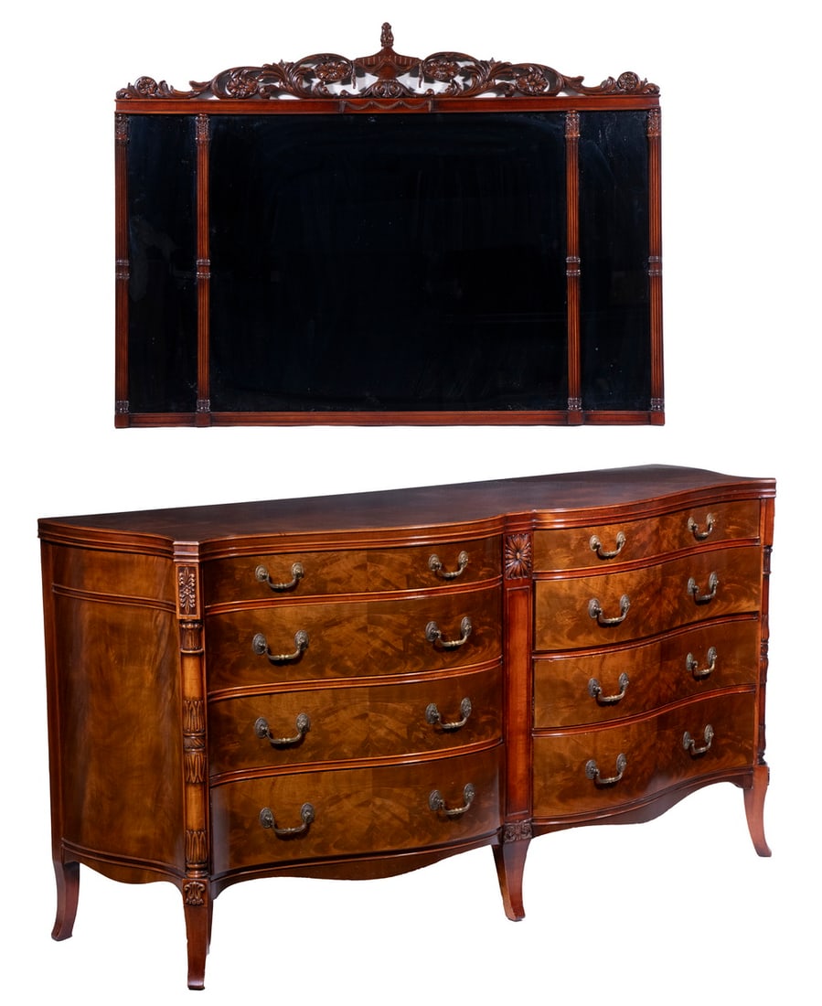 MAHOGANY DOUBLE SERPENTINE CHEST WITH MIRROR: Circa 1940 Custom Sideboard, with matching three-panel mirror, in figured mahogany, the eight-drawer chest with half-column canted corners and carved decoration, removable glass top, the top drawers f