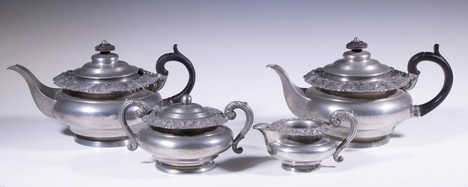 (4 PC) DIXON & SON PEWTER TEA SERVICE: Circa 1830 English Pewter Beverage Set, by James Dixon & Son, squatty design with grapevine decorated collars, ebonized wooden handles, bases stamped "Dixon & Son" (one stamped James Dixon & Son), inc