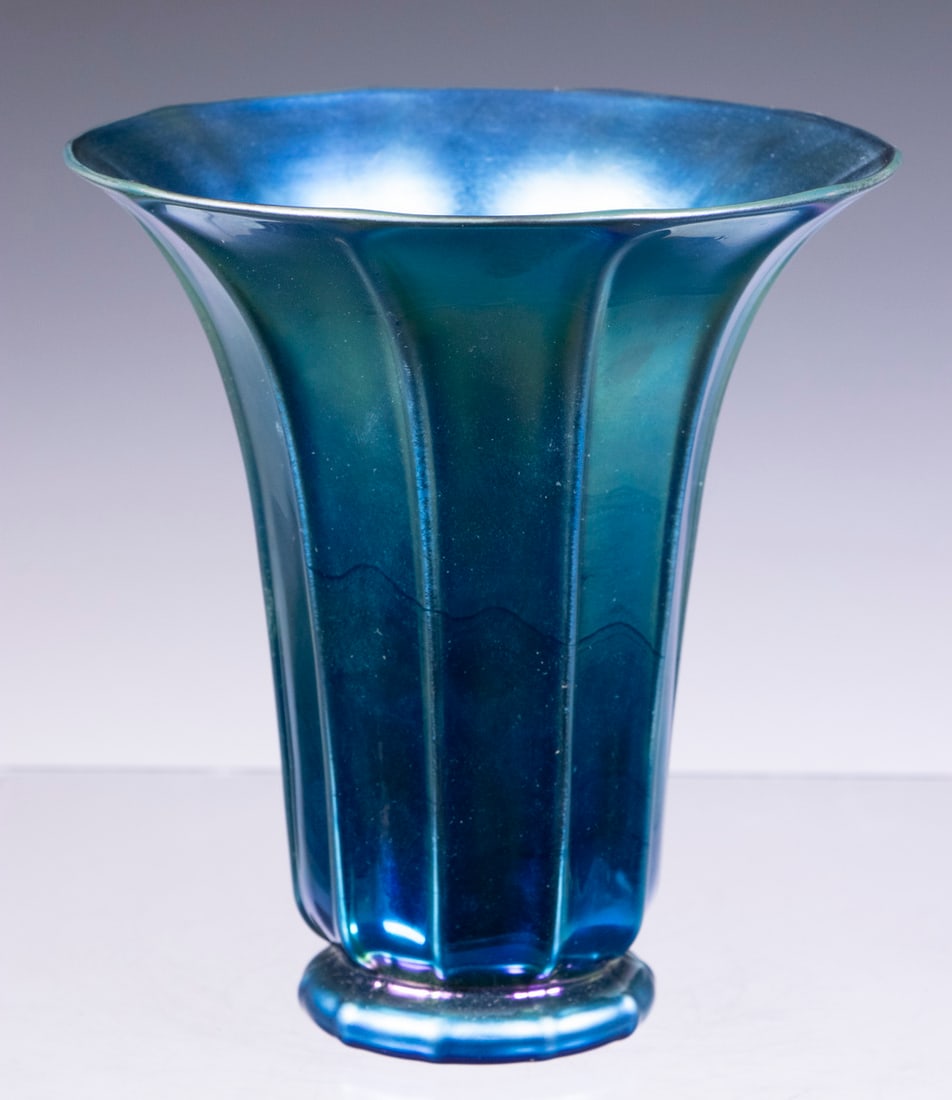 STEUBEN BLUE AURENE RIBBED GLASS VASE: American Iridescent Art Glass Flared Rim Vase, by Steuben, with polished pontil base incised "Steuben Blue Aurene, 913" on base, 5 3/4" high, 5 1/4" diam.From a private Maine collection.