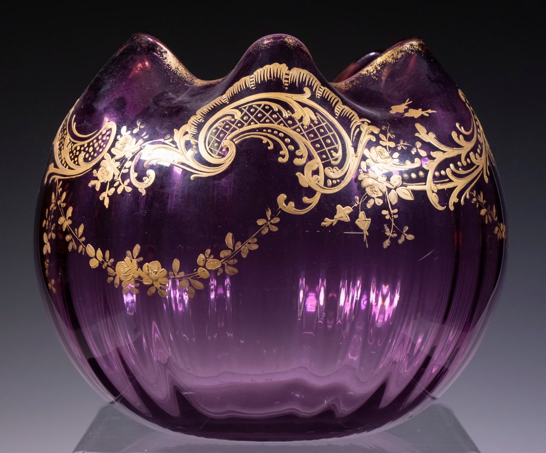 VICTORIAN AMETHYST GLASS ROSE BOWL: Large 19th c. Blown Purple Glass Bowl, probably Bohemian, with enameled gilt floral and scroll decoration, ribbed sides and ruffled rim, polished pontil base, 8 1/2" high, 9" diam.From a private Maine