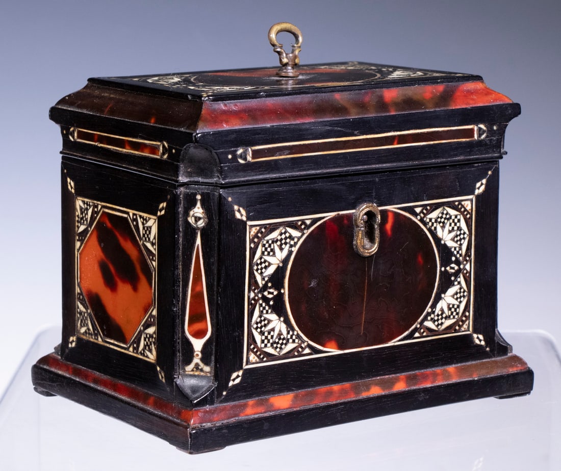 EBONY & BONE INLAID TORTOISESHELL TEA CADDY: 19th c. Rectangular Tea Box, in ebony wood with tortoiseshell veneer and intricate geometric bone inlaid decoration, having a stepped top and canted sides, mother-of-pearl lid plaque engraved "Green",