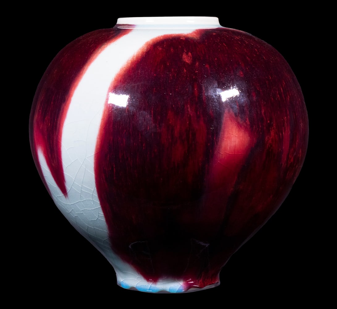 BROTHER THOMAS BEZANSON (CANADA/VT, 1929-2007): Large Ovoid Porcelain Vase, in dark copper red over celadon glaze, ca. 1980, signed with artist's painted cipher on base, crafted while Brother Thomas was a member of the Weston Priory monastic commun