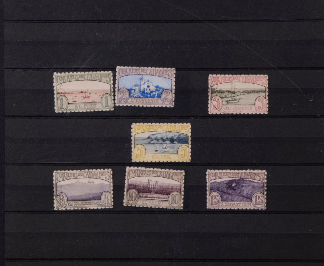 DONALD EVANS (NY, 1945-1977): Seven Fantasy Postage Stamps from "Correus de Cadaques", watercolor on paper with edge perforation made by a string of periods on a vintage typewriter. Actual stamp size, loose in black album shelf pa